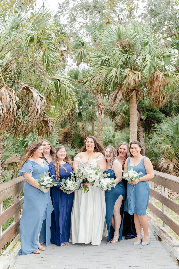 bride posing with her bridesmaids at the florida wedding venue verandah golf club in fort myers