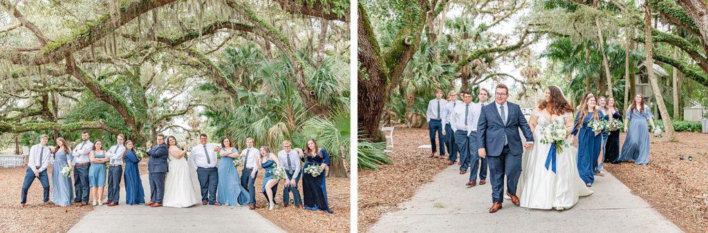 The wedding party posing for photos after the ceremony surrounded by large oak trees. 