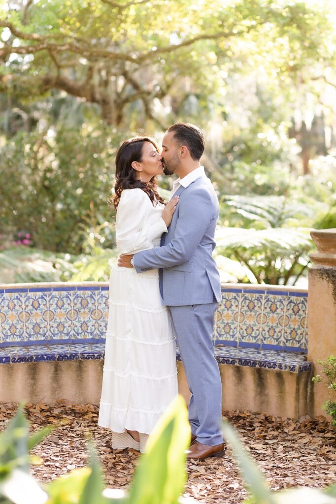 Couple kissing during their engagement session at bok tower gardens. Taken by their Orlando wedding photographer.