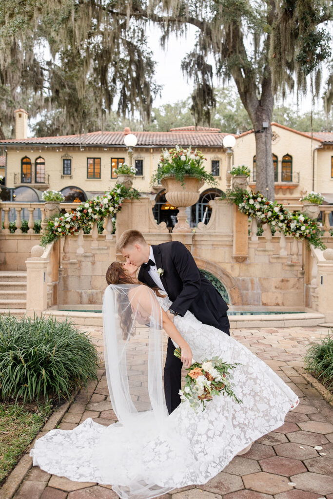 bride and groom couple portraits in front of the fountain at Epping Forest Yacht Club in Jacksonville, Florida, captured by Snapshots by Gabriela