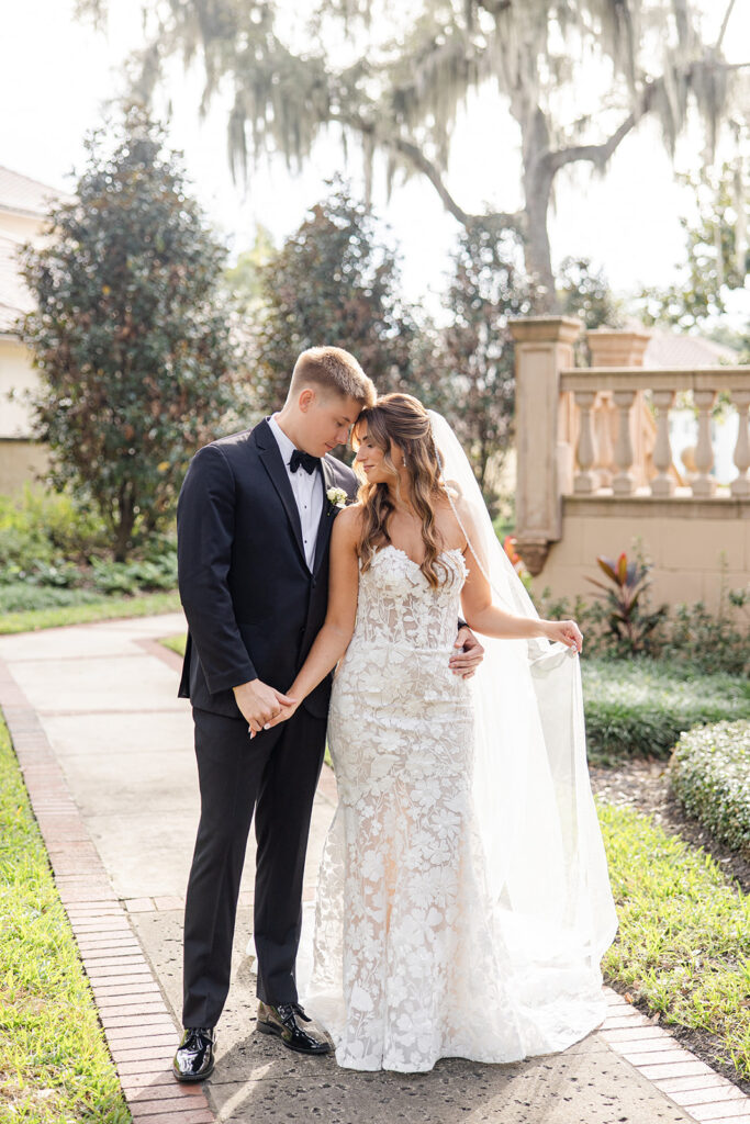 bride and groom couple portraits in front of the outdoor stone staircase at Epping Forest Yacht Club in Jacksonville, Florida, captured by Snapshots by Gabriela