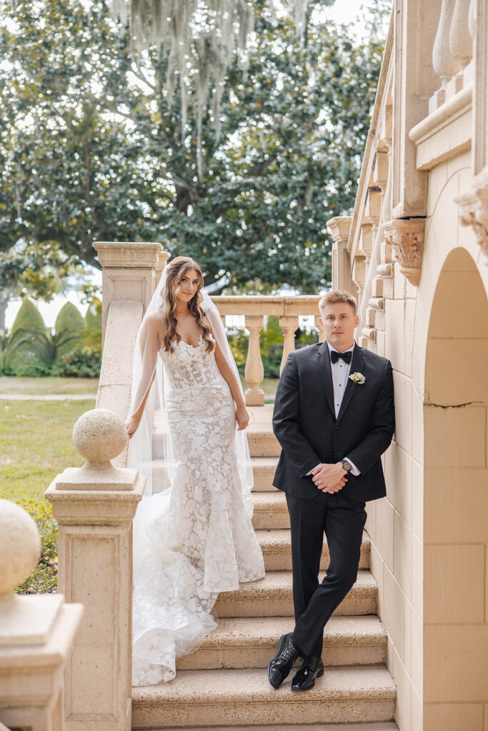 bride and groom couple portraits in front of the outdoor stone staircase at Epping Forest Yacht Club in Jacksonville, Florida, captured by Snapshots by Gabriela