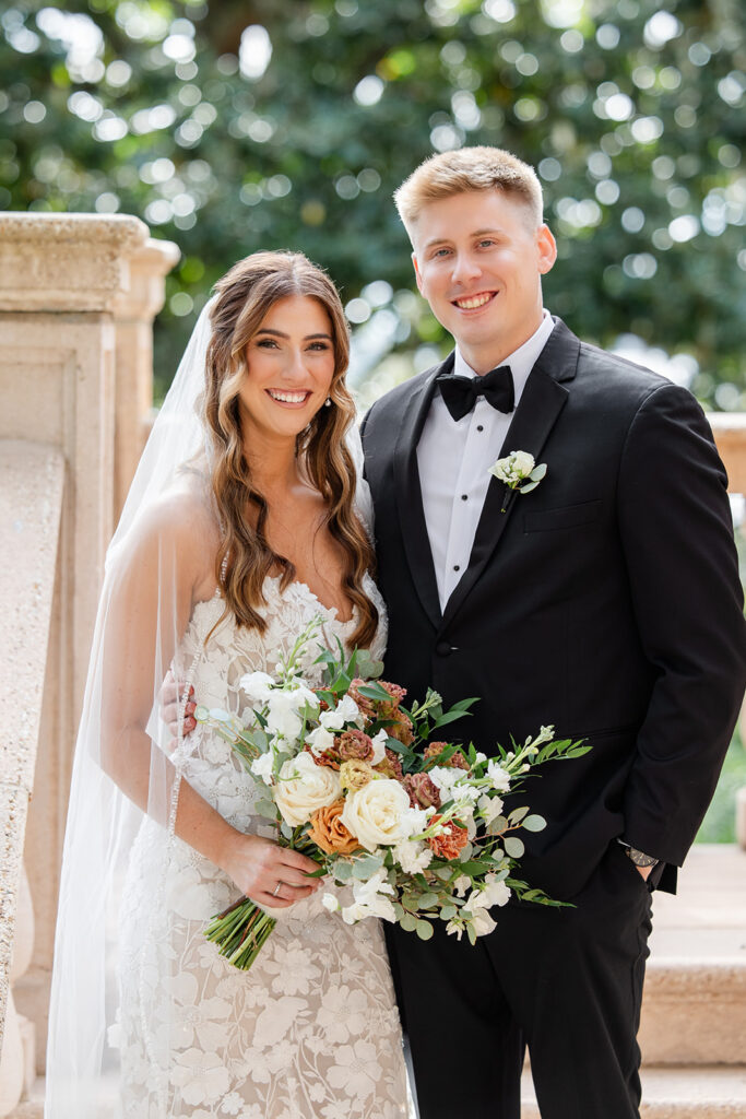 bride and groom couple portraits in front of the outdoor stone staircase at Epping Forest Yacht Club in Jacksonville, Florida, captured by Snapshots by Gabriela