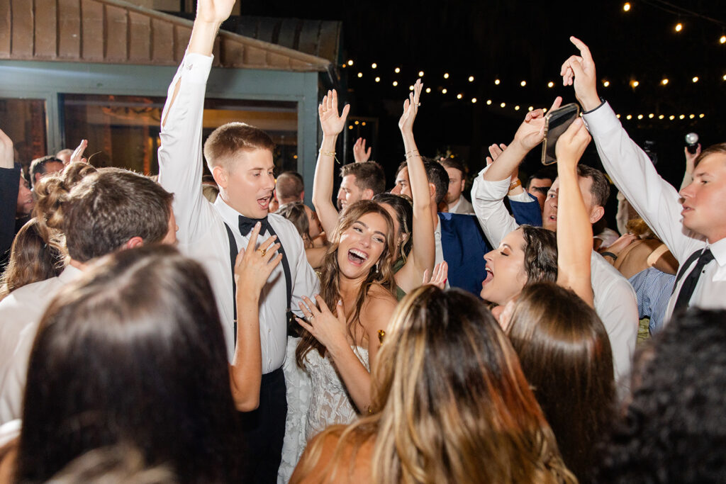 bride and groom dancing surrounded by guests at an outdoor wedding reception at Epping Forest Yacht Club in Jacksonville, Florida, captured by Snapshots by Gabriela