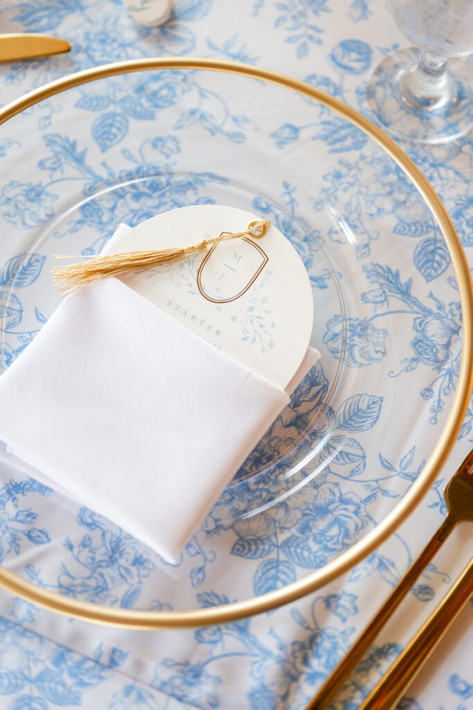 dusty blue wedding tablecloth with a clear charger plate at Bella Cosa Lakeside in Lake Wales Florida