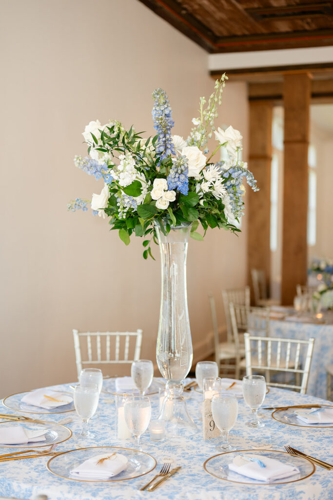 blue and white floral arrangement at a wedding reception at Bella Cosa Lakeside in Lake Wales Florida