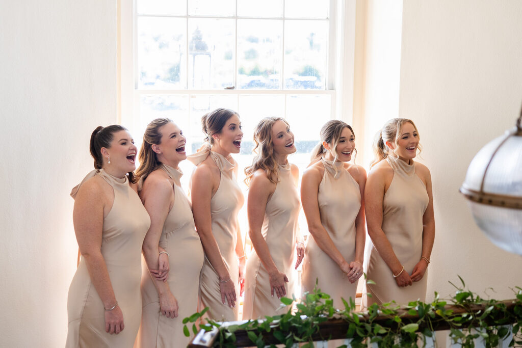 bridesmaids first look at an outdoor wedding at Adams Estate in Lake Alfred, Florida, captured by Snapshots by Gabriela