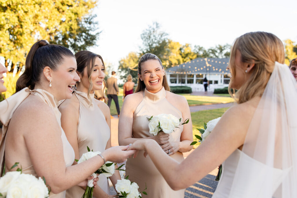 bride with bridesmaids in champagne dresses at an outdoor wedding at Adams Estate in Lake Alfred, Florida, captured by Snapshots by Gabriela