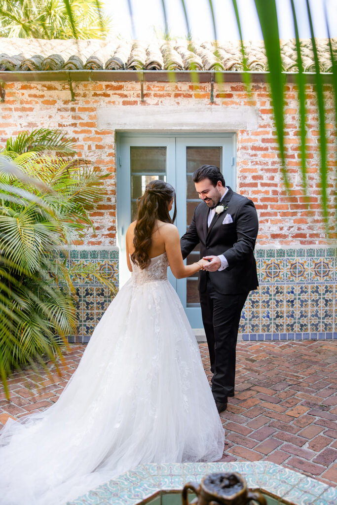 bride and groom first look at historic estate wedding venue Casa Feliz in Winter Park, Florida, photographed by Snapshots by Gabriela