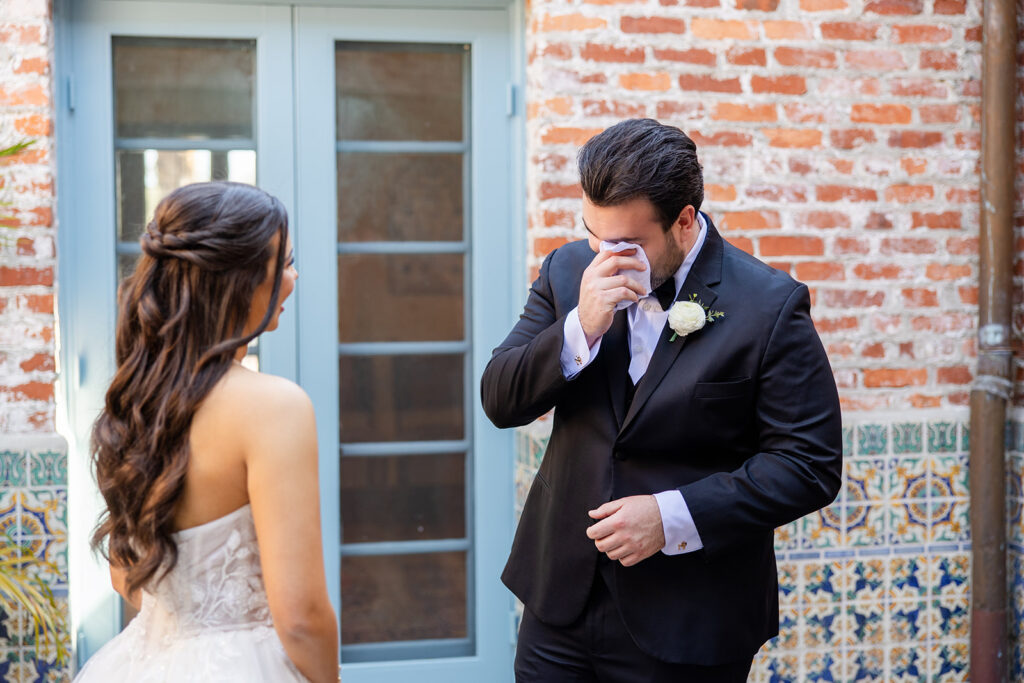 bride and groom first look at historic estate wedding venue Casa Feliz in Winter Park, Florida, photographed by Snapshots by Gabriela