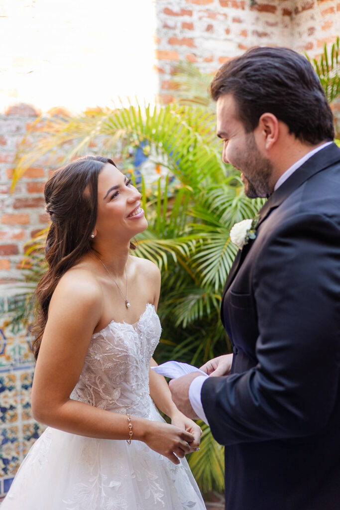 bride and groom first look at historic estate wedding venue Casa Feliz in Winter Park, Florida, photographed by Snapshots by Gabriela