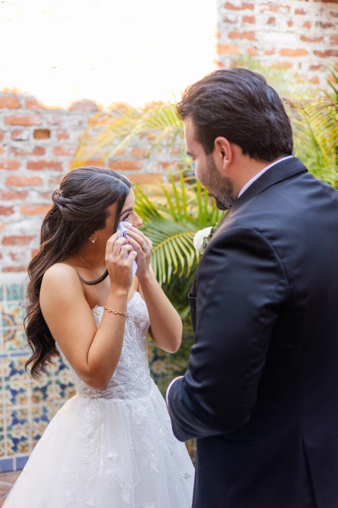 bride and groom first look at historic estate wedding venue Casa Feliz in Winter Park, Florida, photographed by Snapshots by Gabriela