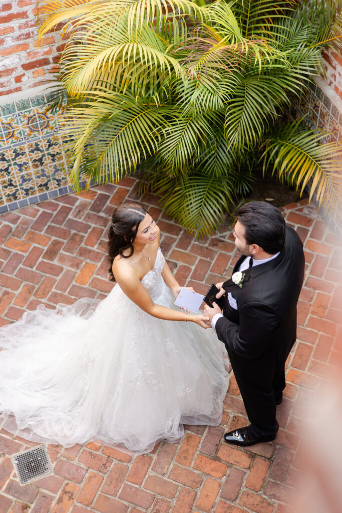 bride and groom first look at historic estate wedding venue Casa Feliz in Winter Park, Florida, photographed by Snapshots by Gabriela