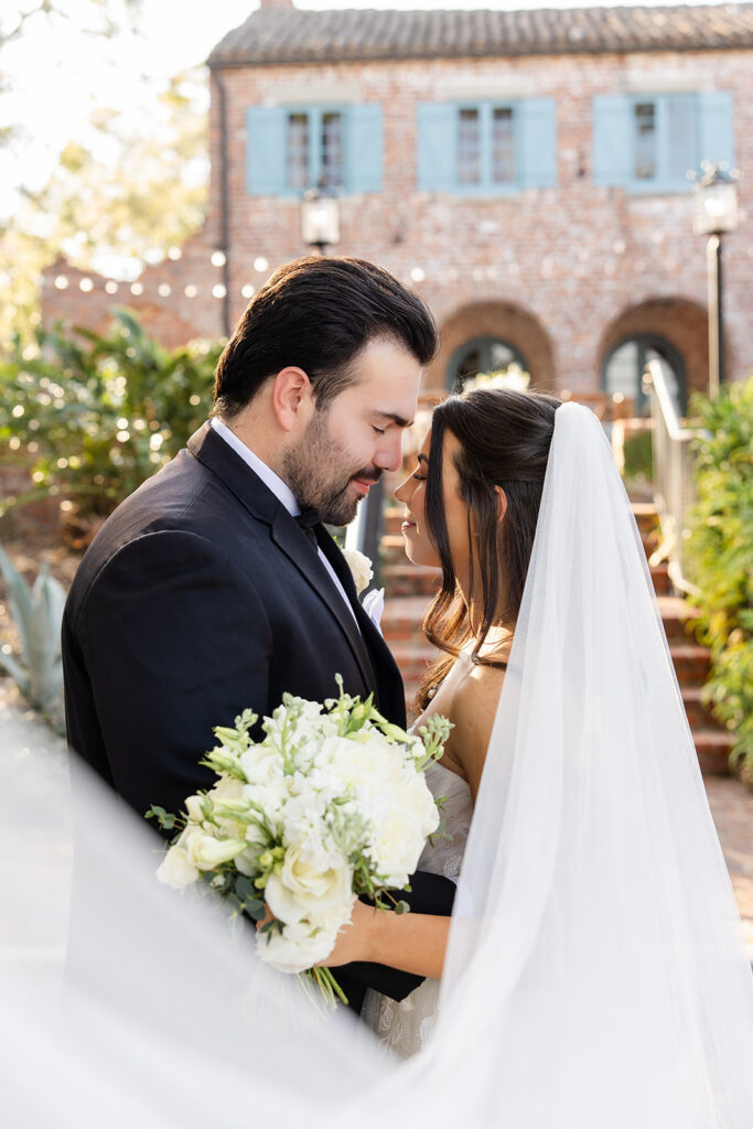 bride and groom golden hour portrait at historic estate wedding venue Casa Feliz in Winter Park, Florida, photographed by Snapshots by Gabriela
