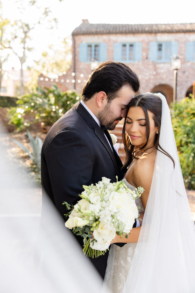 bride and groom golden hour portrait at historic estate wedding venue Casa Feliz in Winter Park, Florida, photographed by Snapshots by Gabriela