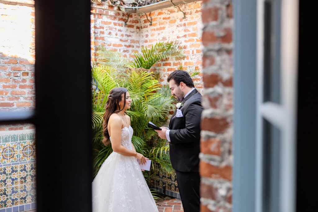 bride and groom first look at historic estate wedding venue Casa Feliz in Winter Park, Florida, photographed by Snapshots by Gabriela