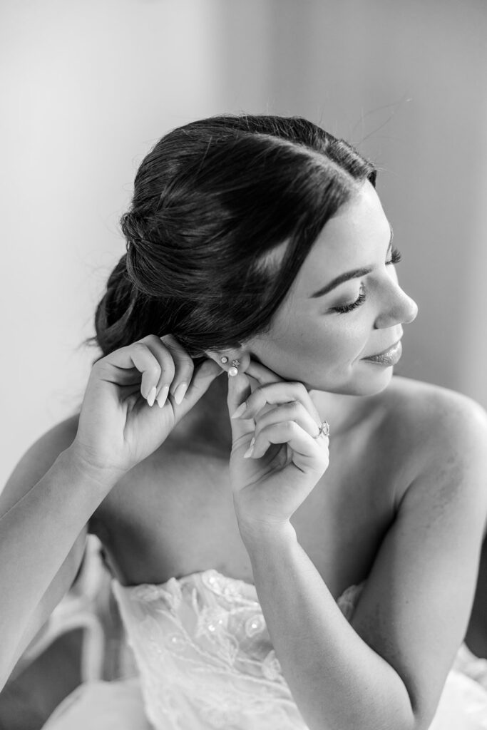 bride getting dressed at historic estate wedding venue Casa Feliz in Winter Park, Florida, photographed by Snapshots by Gabriela