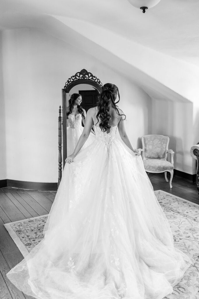 bride getting dressed at historic estate wedding venue Casa Feliz in Winter Park, Florida, photographed by Snapshots by Gabriela