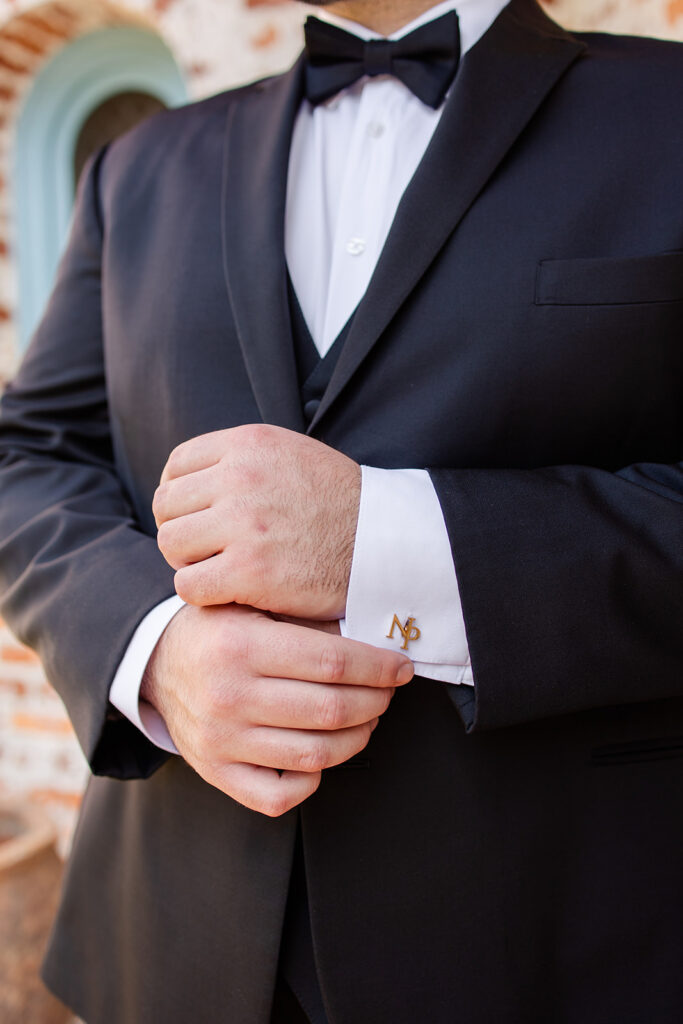 groom getting dressed at historic estate wedding venue Casa Feliz in Winter Park, Florida, photographed by Snapshots by Gabriela