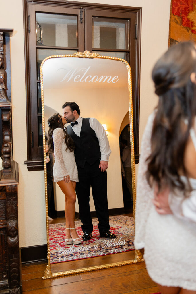 bride and groom kiss into a mirror at historic estate wedding venue Casa Feliz in Winter Park, Florida, photographed by Snapshots by Gabriela