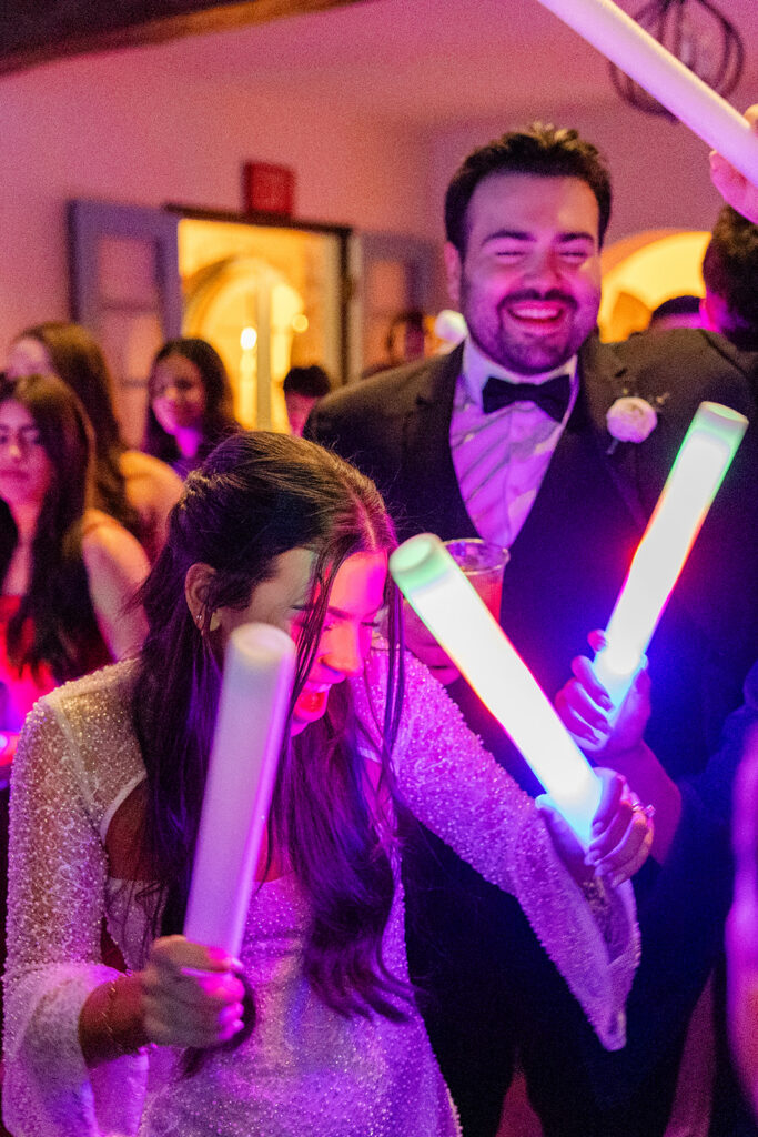 people dancing on the reception dancefloor at historic estate wedding venue Casa Feliz in Winter Park, Florida, photographed by Snapshots by Gabriela