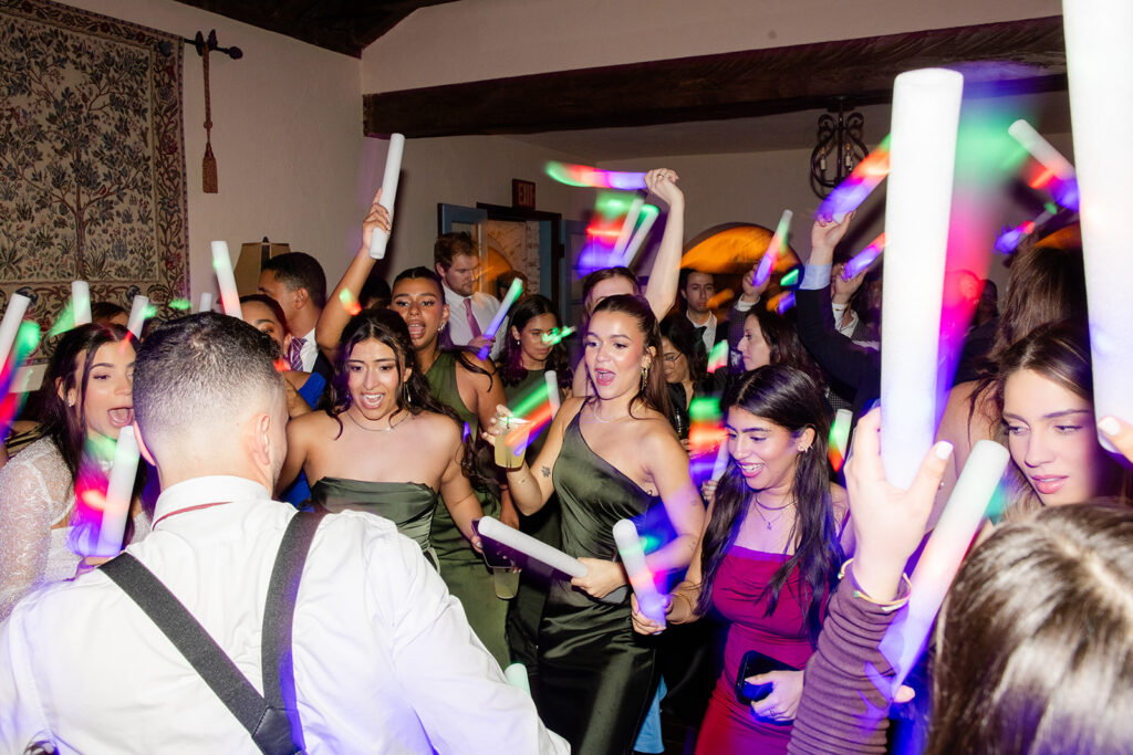 people dancing on the reception dancefloor at historic estate wedding venue Casa Feliz in Winter Park, Florida, photographed by Snapshots by Gabriela