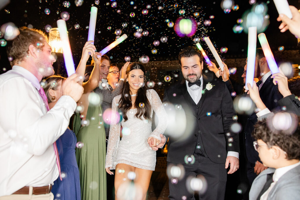 bride and groom during their bubble exit at historic estate wedding venue Casa Feliz in Winter Park, Florida, photographed by Snapshots by Gabriela