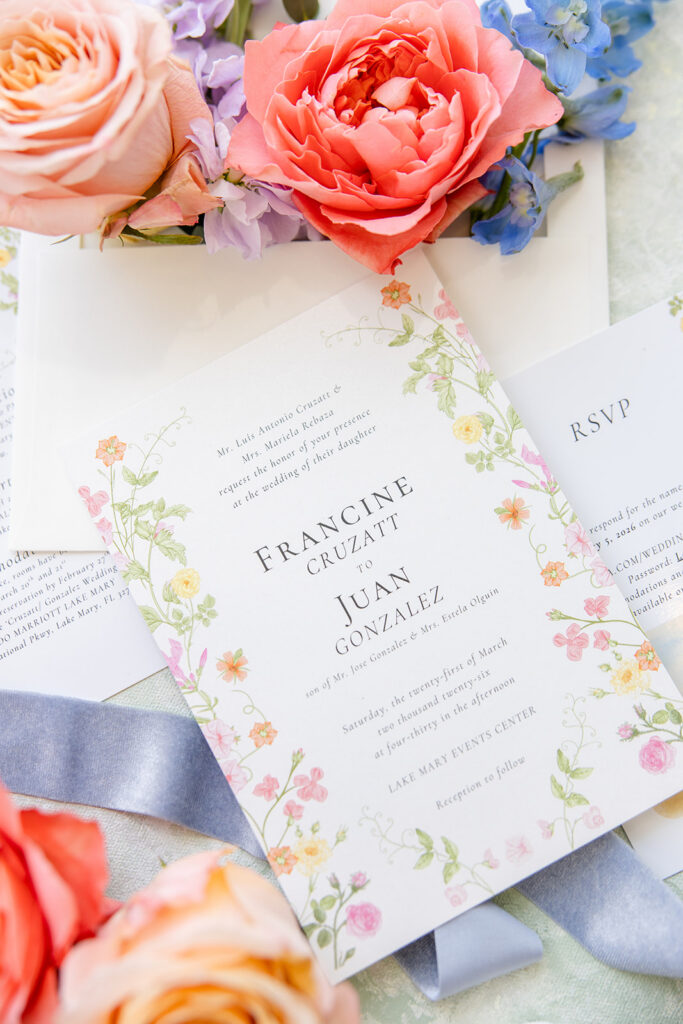 coral, peach, and dusty blue wedding details