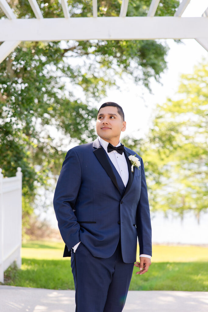 groom in navy suit at a spring wedding at Lake Mary Events Center, captured by Snapshots by Gabriela