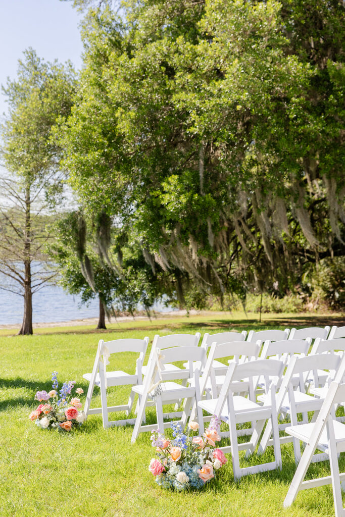 outdoor wedding ceremony setup with spring flowers at Lake Mary Events Center, captured by Snapshots by Gabriela