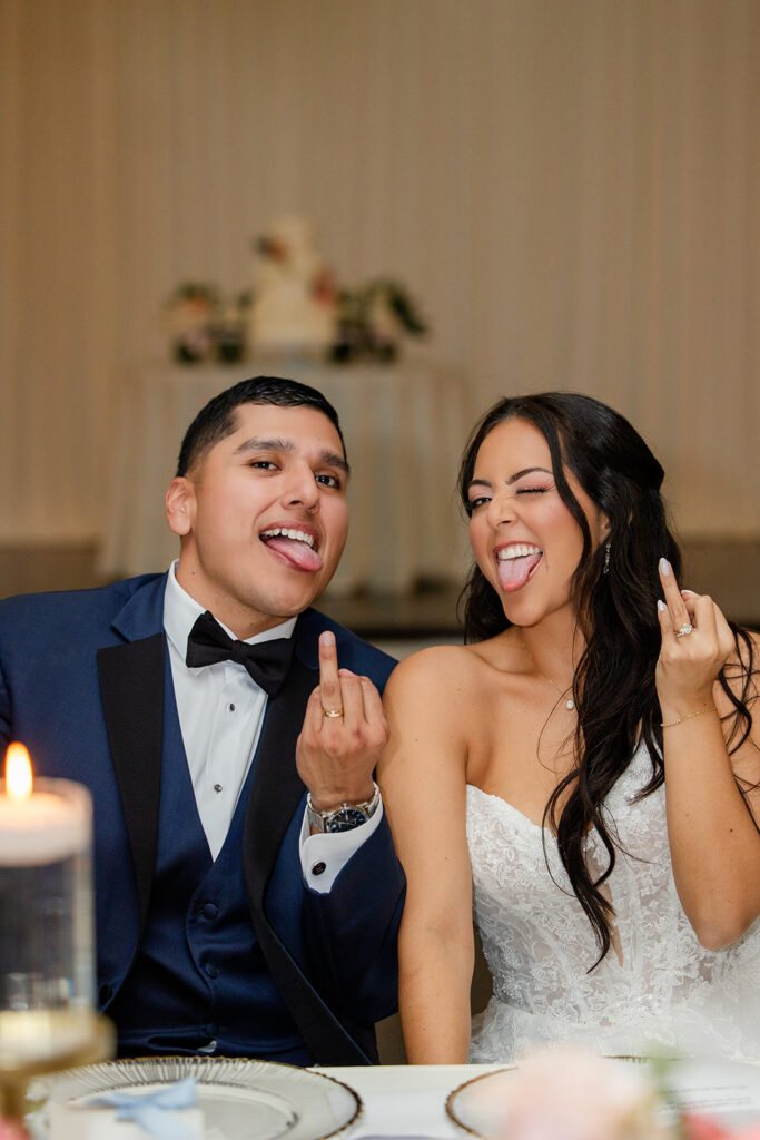 bride and groom showing off their wedding rings at a spring wedding reception at Lake Mary Events Center, captured by Snapshots by Gabriela